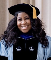 Woman smiling in graduation clothes