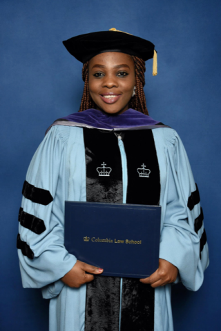 Woman in graduation clothes.