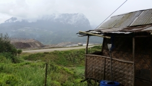 House before a mountain.