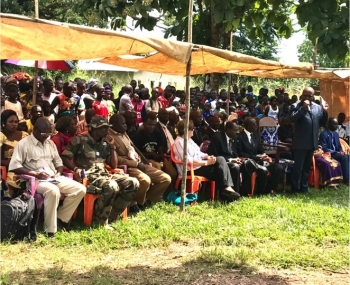 CAR community members sit in ceremony