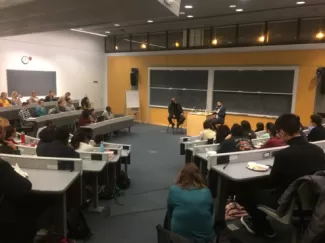 students watch the speakers