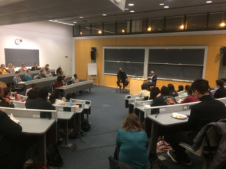 students watch the speakers