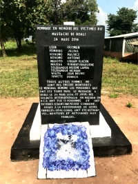 Memorial is adorned with flowers 
