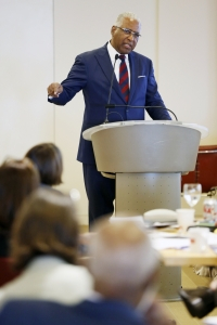 A symposium speaker stands 