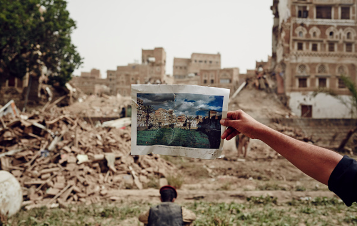 Image of a building held before its ruins in Yemen.