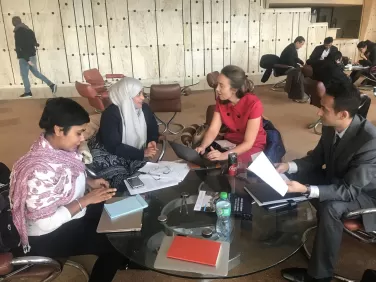 People talking around a table.